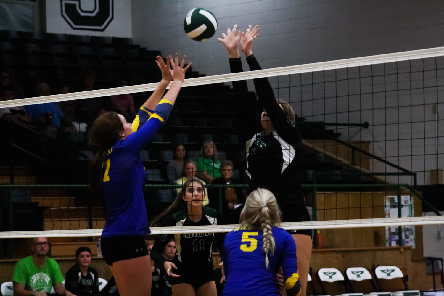 North Callaway sophomore middle blocker Bailey Hill stuffs a Wright City hitter Tuesday in the Ladybirds' five-set win in Kingdom City.