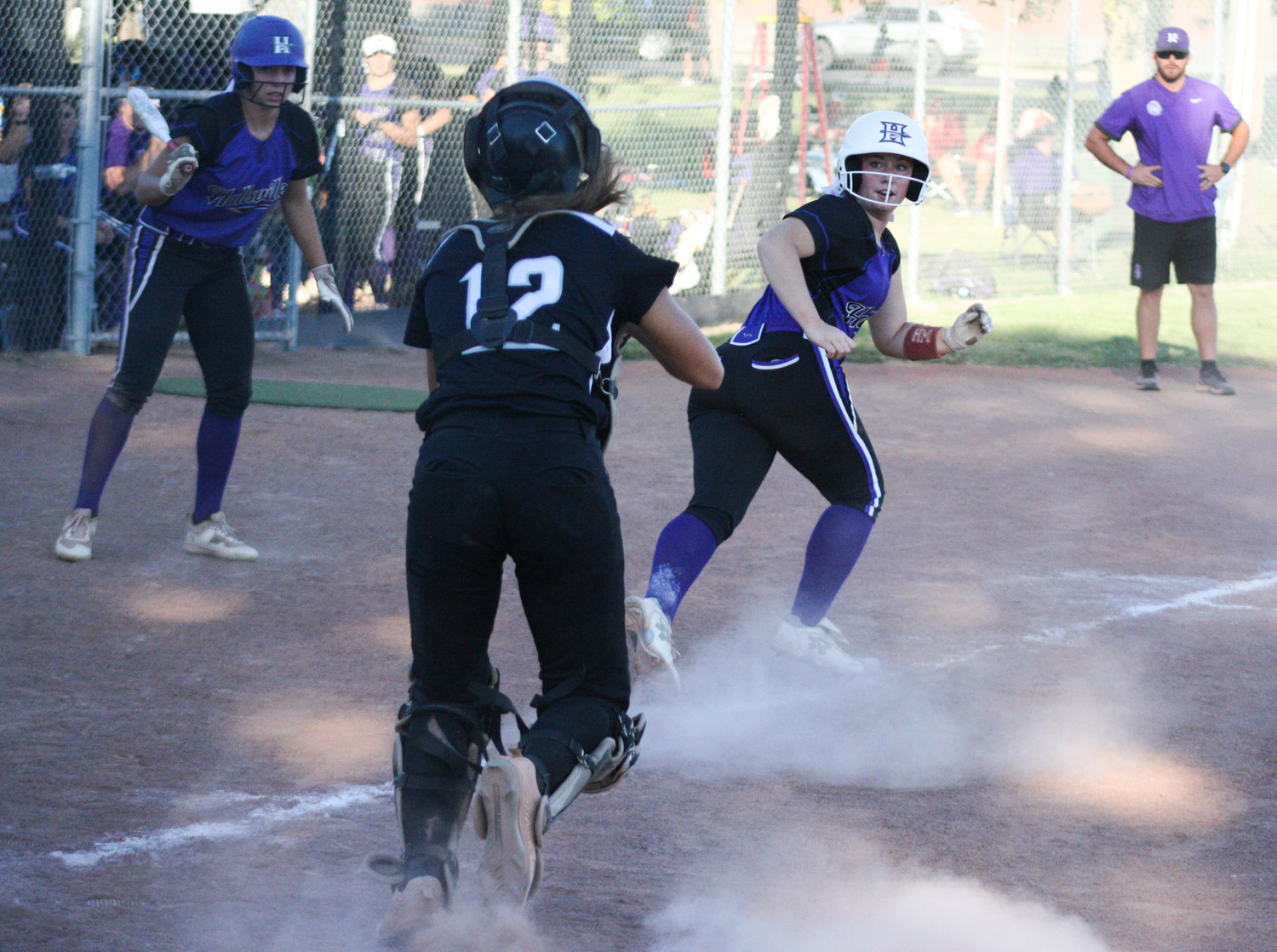 Centralia senior catcher Harper Sontheimer pursues a Hallsville player in a rundown between third base and home plate on Saturday in the team's 5-2 loss in six innings at the Centralia Softball Tournament at Nathan A. Toalson Bicentennial Park in Centralia