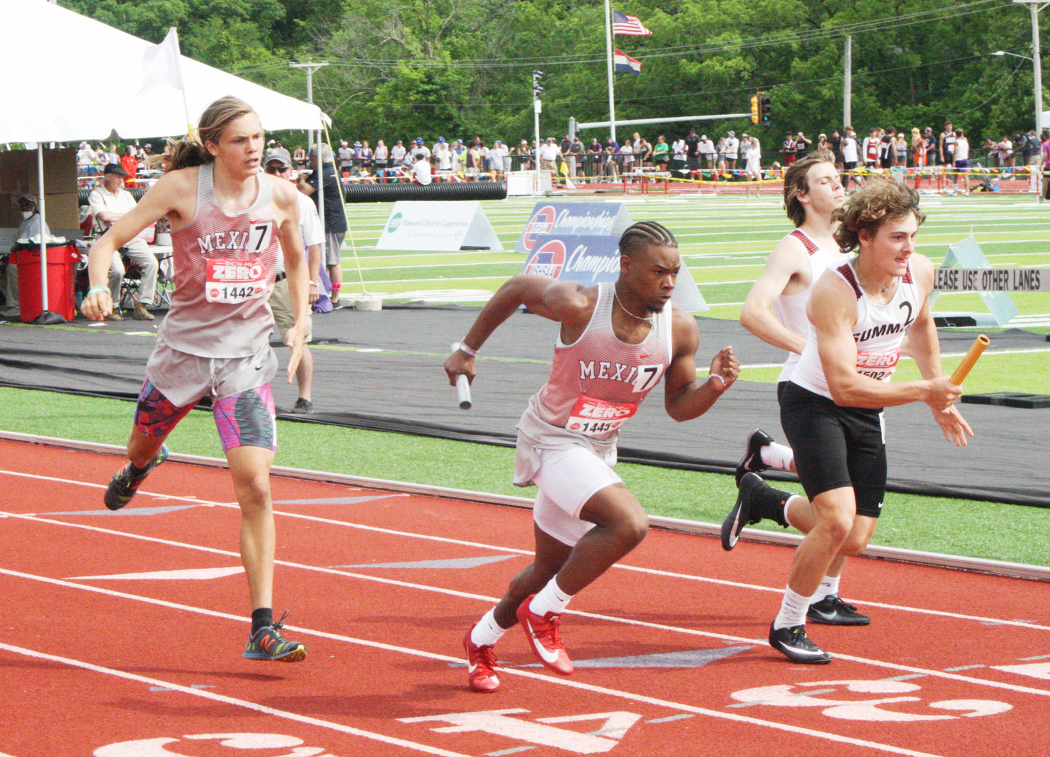 Mexico senior Anthony Shivers takes off after taking the handoff from sophomore Tyler Grimes at last year's Class 2 state meet. The two were part of Mexico's all-state 4x400 relay team.