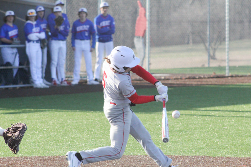 Mexico senior Landyn Kleinsorge takes a pitch to the gap against Moberly on Monday at home.
