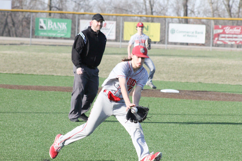 Mexico senior Jack Wilburn fields a tapper from the mound against Moberly on Monday at home.