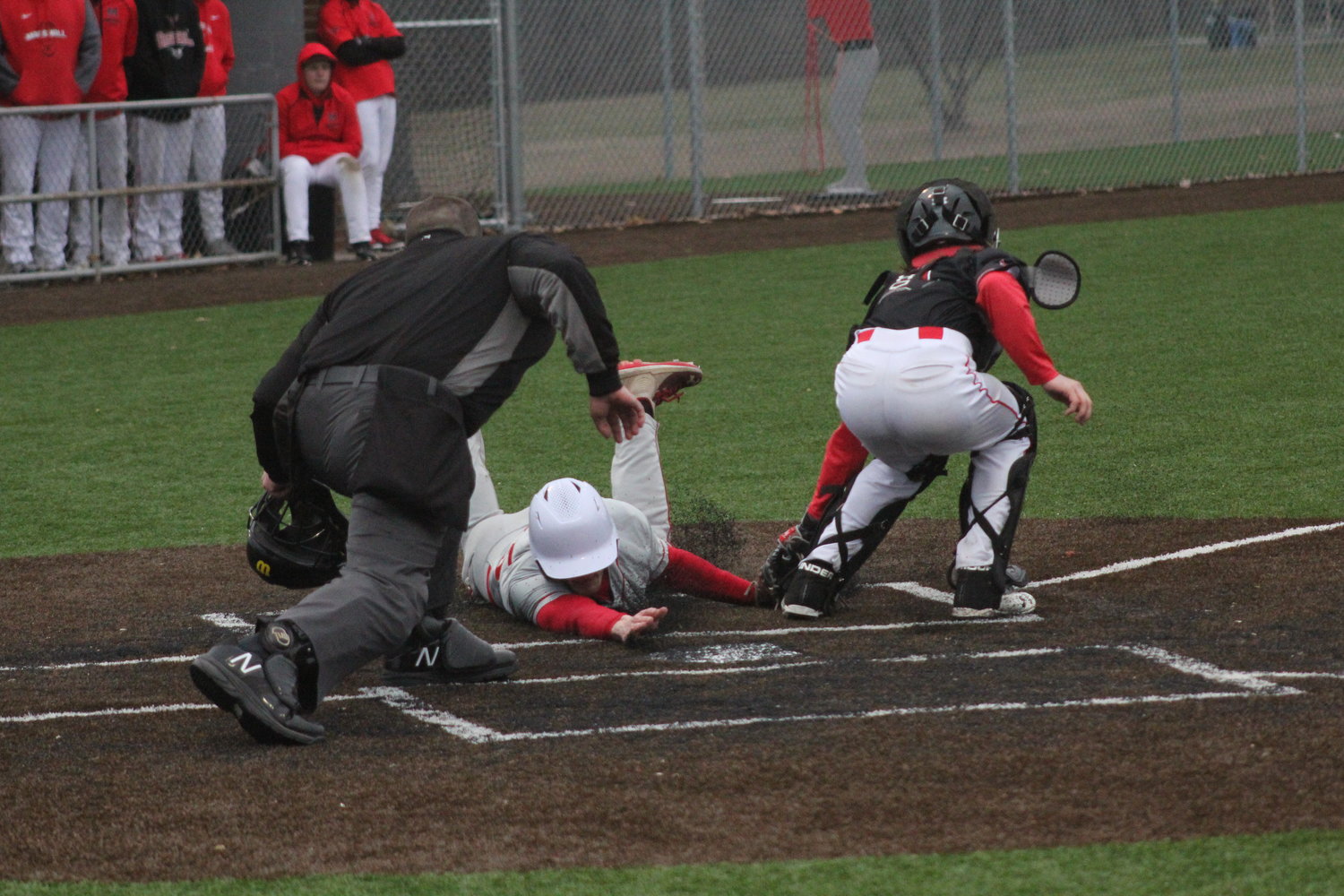 Mexico senior Matt McCurdy slides into home plate against Marshall on Thursday at home. McCurdy was ruled out but had a two-run double in the game.