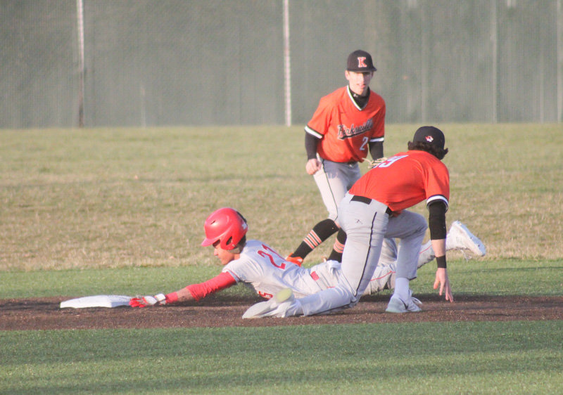 Mexico sophomore Ashton Belcher steals second base against Kirksville on Tuesday in Mexico. It was one of eight stolen bases for the Bulldogs.