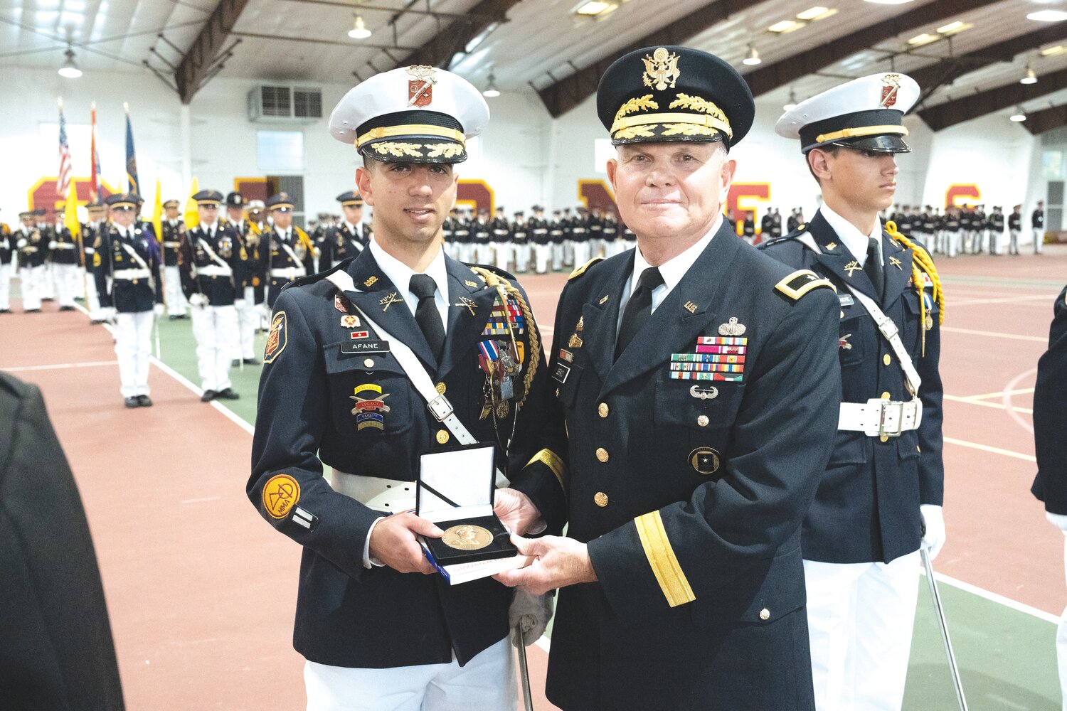 Cadet Marco Afane is joined by MMA President Brigadier General Richard V. Geraci, USA (Ret.)