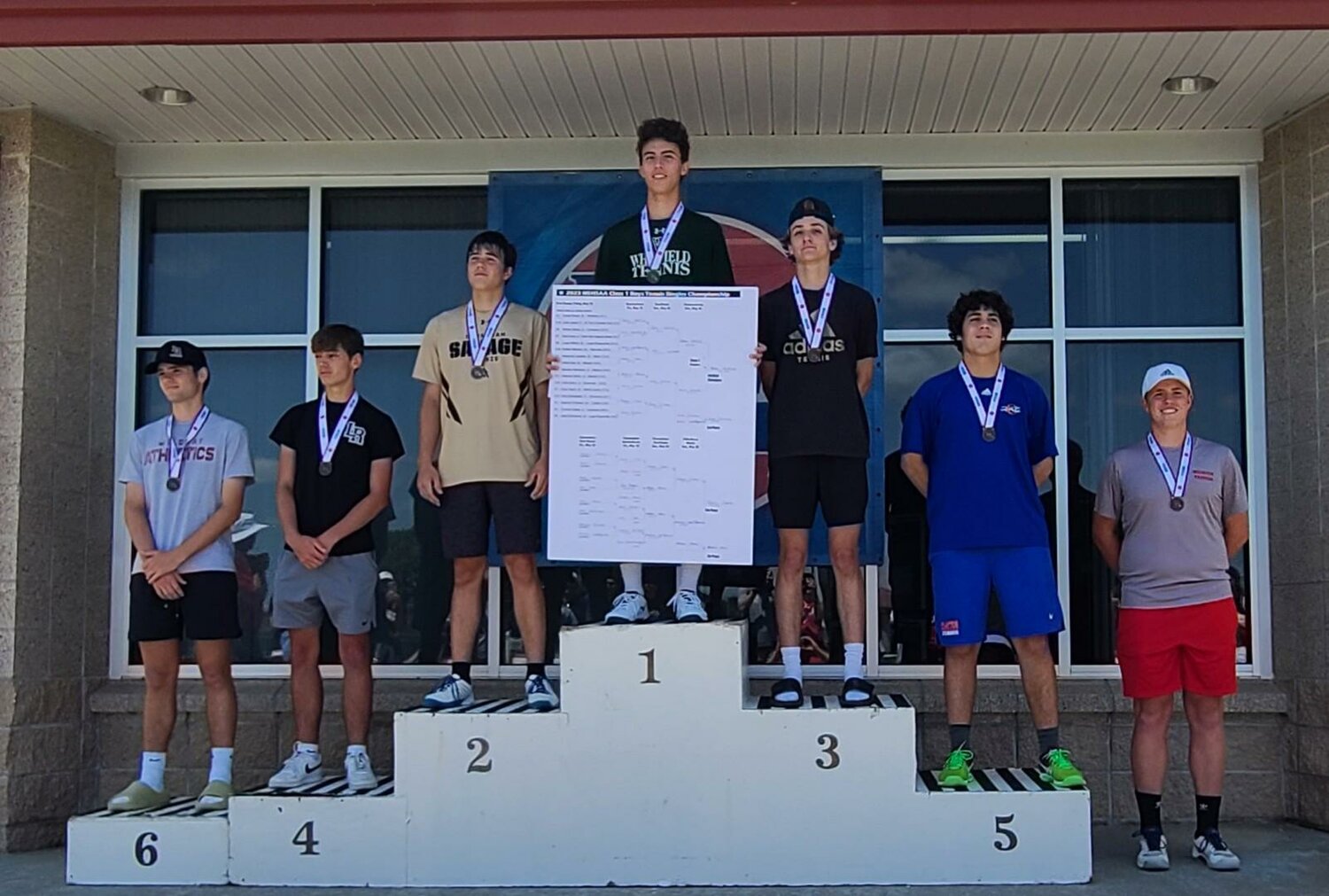 Mexico junior Brendan McKeown stands on the podium at the Class 1 singles boys tennis tournament at Cooper Tennis Complex in Springfield on Saturday with the other state medalists. McKeown earned seventh place.