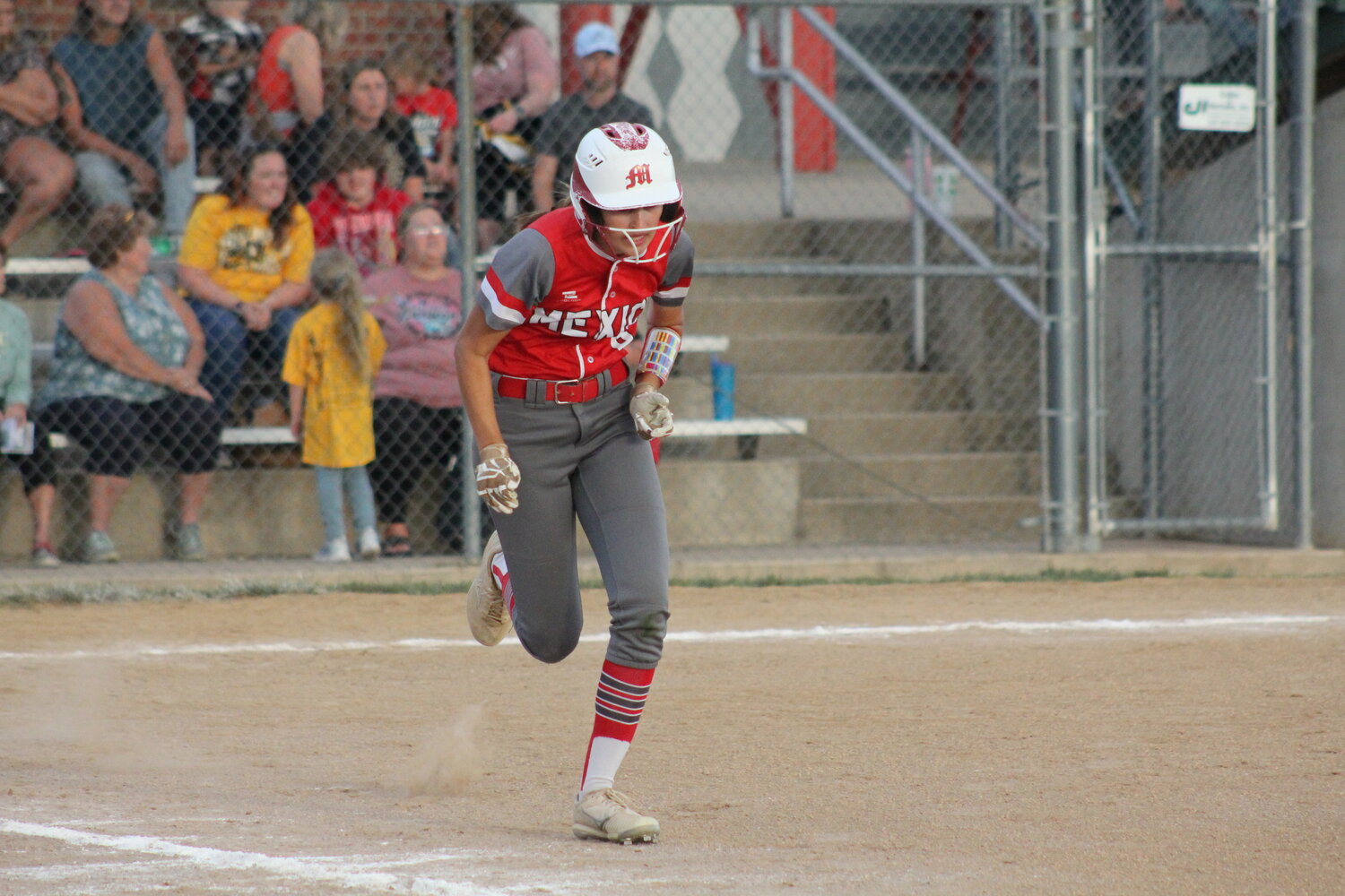 Mexico senior Brooke Teel runs out of the batter's box against Fulton on Thursday at home.