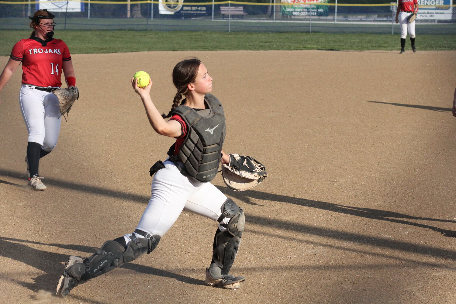 Community R-6 senior Brooklynn Glasgow throws to first base for an out in Paris on Wednesday.