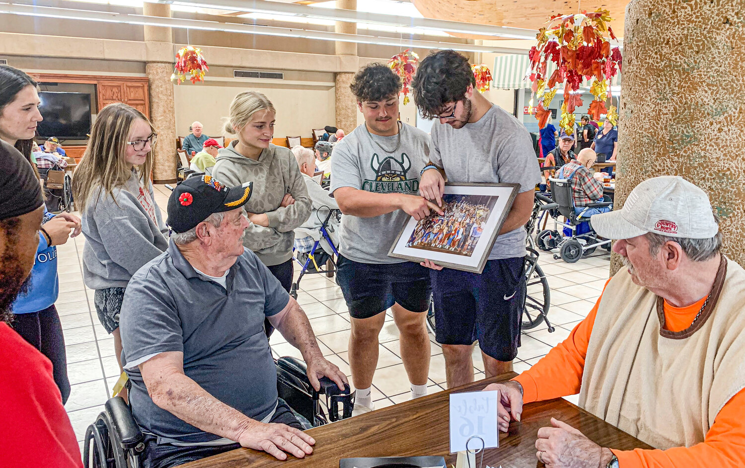 Students from Mexico High School showed a picture from Military Appreciation Night on Sept. 8, to Veterans at the Missouri Veterans’ Home on Monday, Sept. 25.