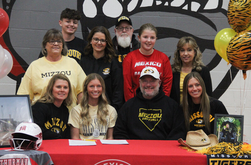 Mexico senior Jordyn Thurman is surrounded by family on Thursday during her signing ceremony to play Mizzou softball.