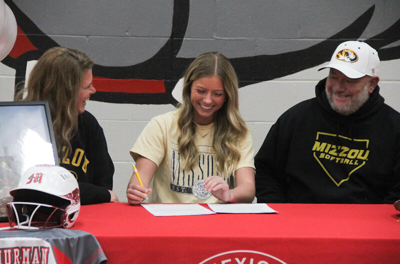 Mexico senior Jordyn Thurman smiles on Thursday in Gary Filbert gym in Mexico as she celebrates her signing to play softball at the University of Missouri.
