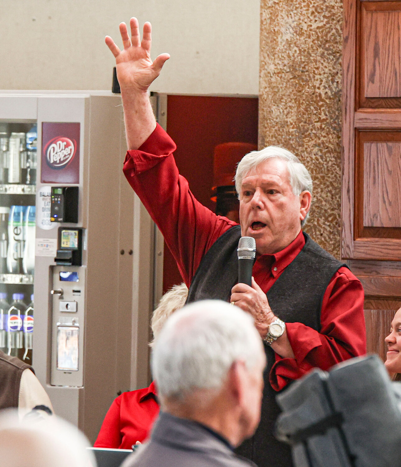 Dr. David Hammer raises his arm and cheers while asking if there are any other Marines in the crowd at the Missouri Veterans’ Home on Friday, Nov. 10.