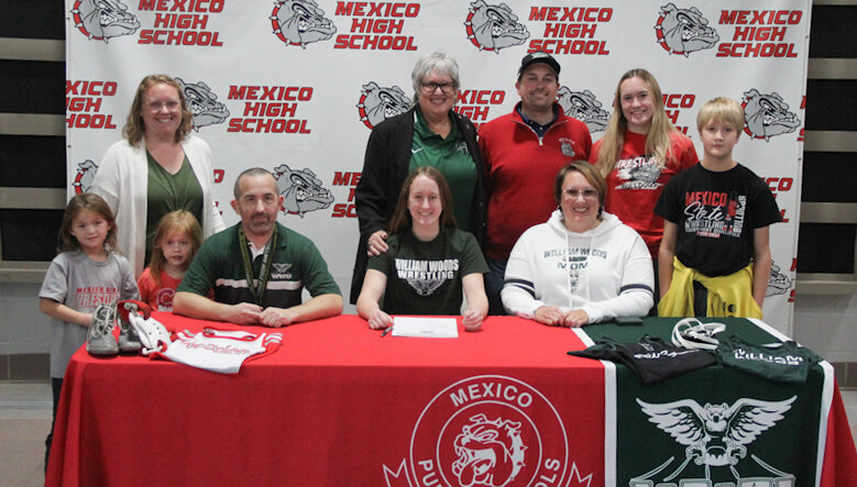 Mexico senior Katie Bowen gathered with her family on Thursday at the Mexico Sports Complex for her signing ceremony to wrestle at William Woods University in Fulton.