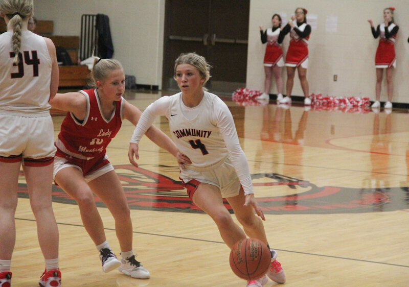 Community R-6 sophomore Peyton Beamer drives against the Marion County defense on Tuesday at home.