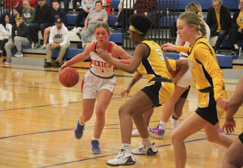 Mexico senior Jo Thurman dribbles against the Fulton defense on Wednesday at the Montgomery County Varsity Basketball Tournament.