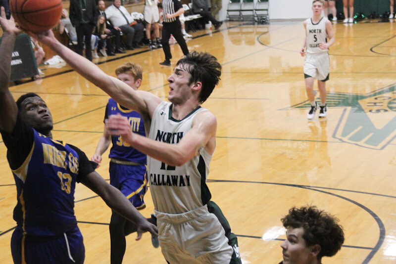 North Callaway senior Sam Pezold rises for a layup against Wright City on Tuesday during Senior Night in Kingdom City. Pezold recorded a double-double and was one of three seniors who scored in double figures in the 63-37 victory.