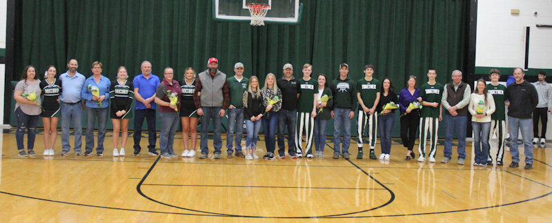 North Callaway's four boys basketball seniors and three cheerleader seniors (Caitlyn Sobba, Samantha Cannon and Cassidy Murphy) are joined by their families on Tuesday during Senior Night.