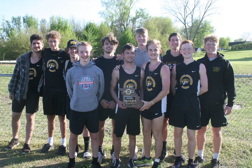 The Wellsville-Middletown boys track team poses with its second-place plaque from the Class 1, District 2 championship meet on May 7 at Glasgow High School. It&rsquo;s the Tigers&rsquo; first district plaque in program history. Pictured are, front row from left, Jonah Slovensky, Jason Hollensteiner, Layne Norris and Hunter Bickell. Back row are Xavier Baig, Gage Marshall, Lucas Moore, Jacob Mandrell, Isaac Seabaugh, Cooper Henderson and Keaton Mayes.