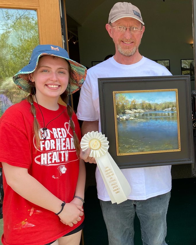 Montgomery City resident Meredith Rodgers, left, poses with first-place winner Farley Lewis after one of the contests at the Augusta Plein Air Festival on April 27. Rodgers was the only college student chosen to participate in the event. She also worked as one of the judges.