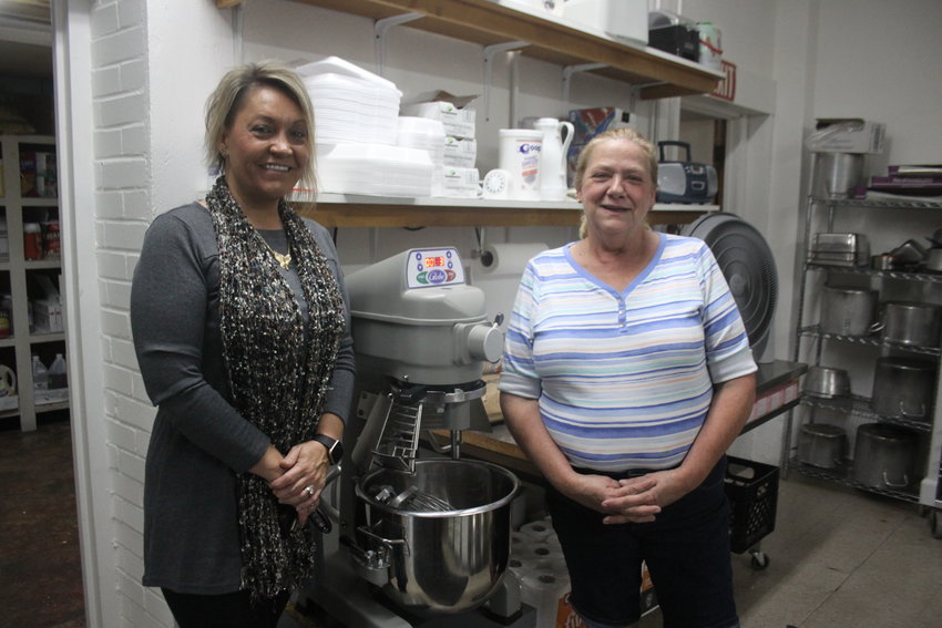 Montgomery City Area Chamber of Commerce president Desiree Peak and Montgomery County Senior Center head cook Lisa Jahner pose with the new mixer the Senior Center received several months ago.