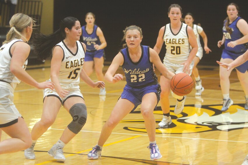 Montgomery County senior Malia Rodgers dribbles at midcourt in the first quarter against Sullivan on Nov. 17. Rodgers and the Wildcats beat Sullivan 44-21 to start their 2023-24 season.