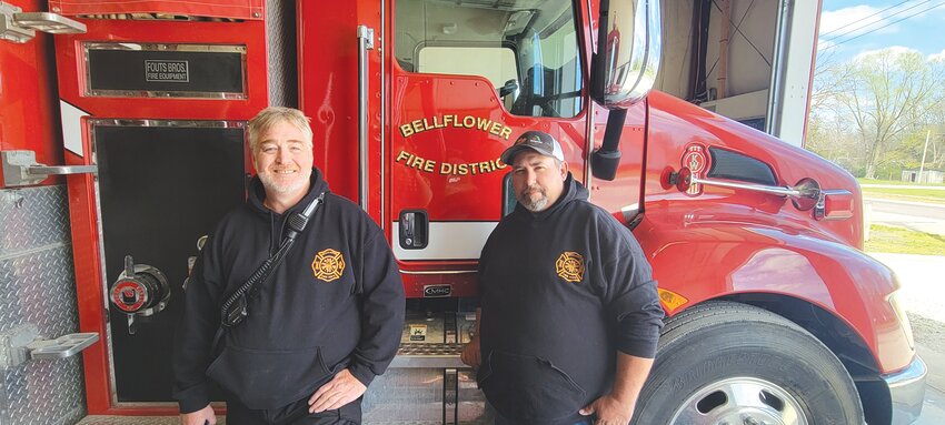 Shane Fulbright and Chief Paul Eveland of the Bellflower Volunteer Fire Protection District pose at the firehouse. The fire district has launched a community outreach program that includes several events.