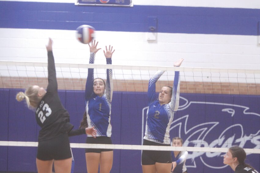 Aubrey Janes (1) and Khloe Kribbs (2) of Montgomery County attempt to block a hit from North Callaway’s Avis Endres during an Eastern Missouri Conference volleyball match on Sept. 19.  The Wildcats won in three games for their first victory of the season.