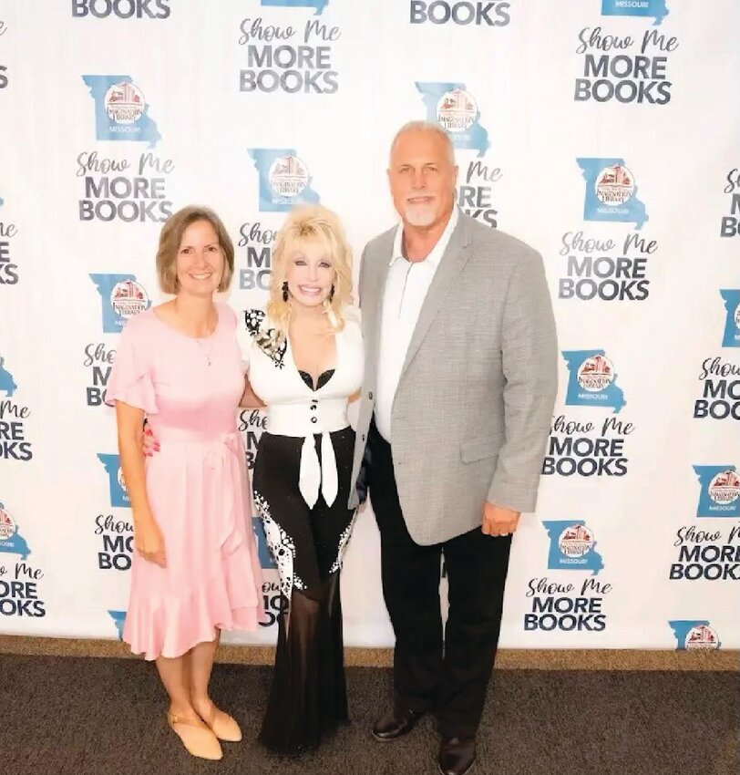 Montgomery City resident Jeff Porter, right, poses with his wife Julie and actress/singer Dolly Parton during a Statewide Imagination Library Celebration event in Kansas City on Aug. 27.