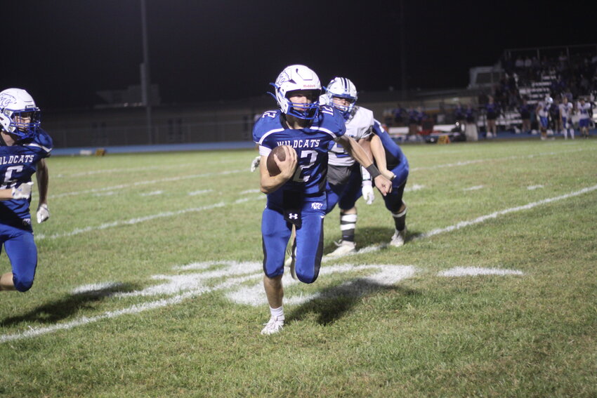 Montgomery County junior quarterback Adrian Combs goes for a carry in the second quarter against Mark Twain on Oct. 4.