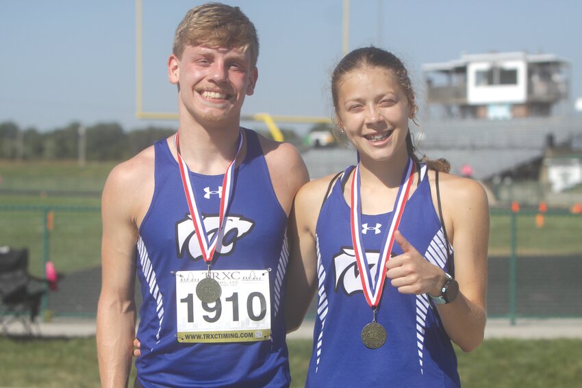 Jadrian Thurmon and Emma Rodgers pose with their medals they earned at the North Callaway Invitational on Oct. 5. Thurmon placed third in the boys race, while Rodgers came out on top in the girls race.