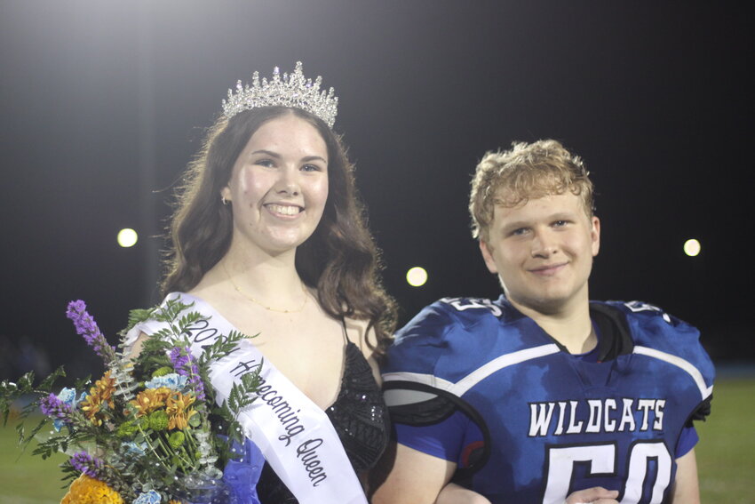 Montgomery County senior Rebecca Schulze poses with Jordan Hicks after being named homecoming queen on Oct. 4.