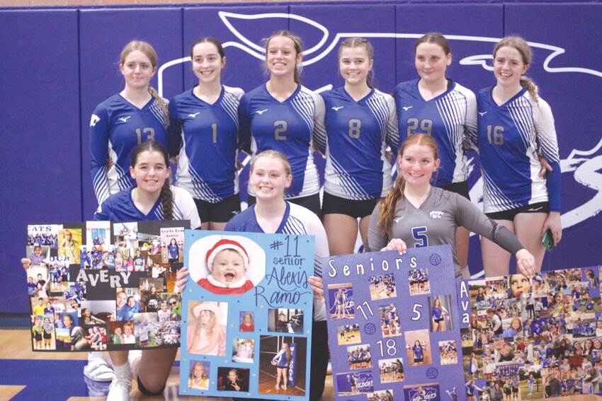 Montgomery County seniors Avery Leu, Alexis Ramo and Ava Rakers pose with their posters and their teammates after helping their team beat Bowling Green in five games in the Wildcats’ senior night match on Oct. 10. In the back are Keira Ray-Wise, Aubrey Janes, Khloe Kribbs, Megan Pierson, Kylie Powell and Mieka Ray-Wise.