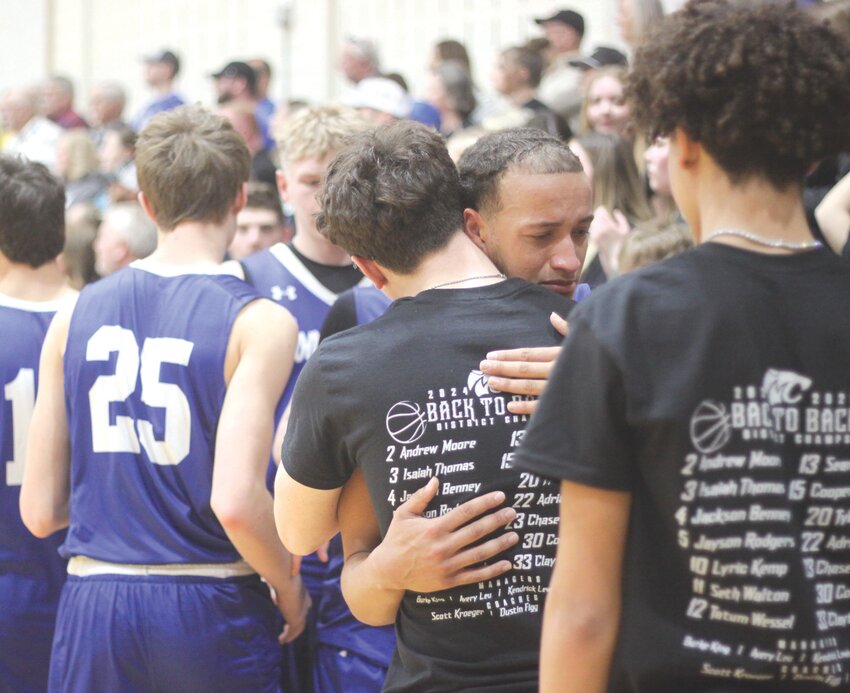 Montgomery County senior Isaiah Thomas hugs manager Burke King in the closing seconds of the Class 3 Show-Me Showdown quarterfinals against Principia on March 7 at Webster Groves. The Wildcats lost 77-55 to end their season at 28-2.