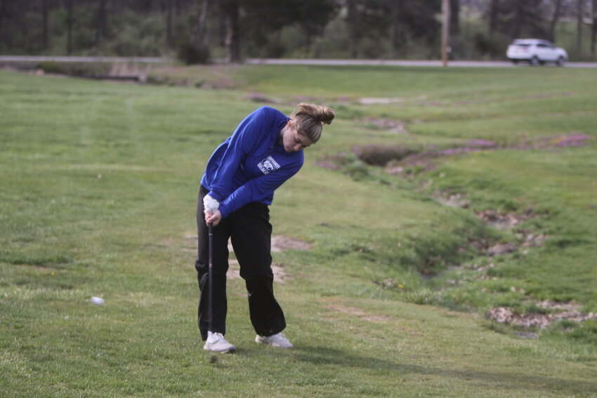 Montgomery County senior Kinsley Hutcheson fires a shot in the No. 8 hole in a match against MMA, South Callaway, Wright City and Silex on April 1 at Wildcat Golf Course. Hutcheson accepted a full-ride scholarship to play golf at Crowder College next year.