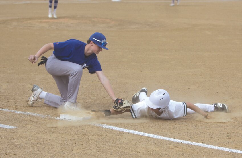 Montgomery County freshman first baseman Marshall Bishop attempts to pick off a North Callaway runner on April 24.