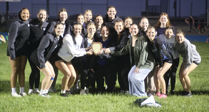 The Montgomery County girls track team poses with its Eastern Missouri Conference plaque after winning the league championship meet on May 2 at Jim Blacklock Field.