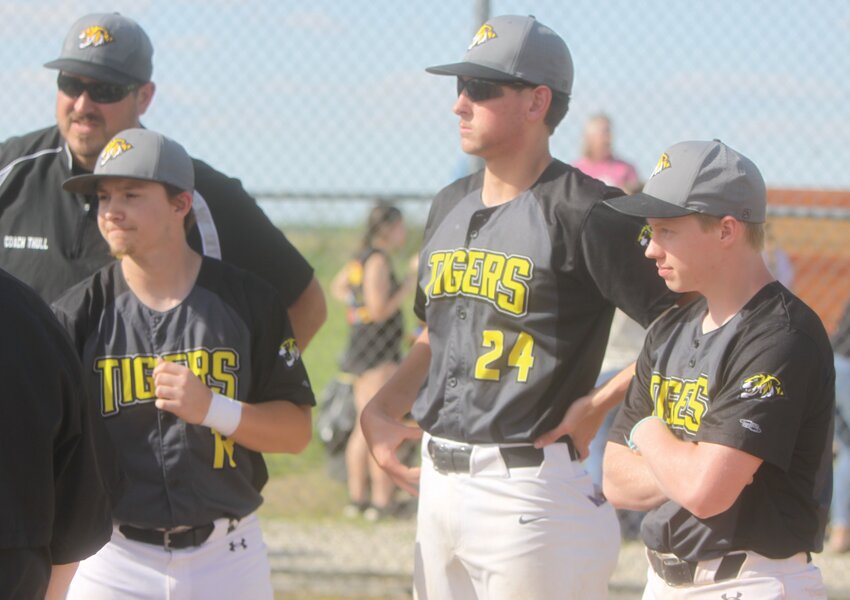 Wellsville-Middletown seniors Brennan Cash, Cooper Henderson and Wyatt Moore meet with Missouri Military Academy players before the game on May 6. Cash, Henderson and Moore celebrated senior day by helping the Tigers beat MMA 16-1 in three innings.