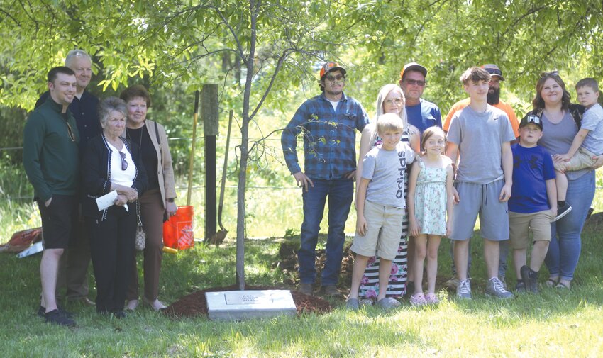 The Old Settlers Association held a tree planting ceremony on May 10 in honor of Don Talbot, who passed away in 2003. Pictured are Ian Reynolds (grandson), Linda Talbot (wife), Penny Struebig (daughter), Eric Struebig (son-in-law), Landon Talbot (grandson), Ernie Talbot (son), Carina Talbot (daughter-in-law), Liam Talbot (grandson), Nevaeh Talbot (granddaughter), Kayden Morris (grandson), Mason Talbot (grandson), Kristian Talbot (granddaughter-in-law), Hunter Talbot (great-greatson) and Teagan Talbot (great-grandson).
