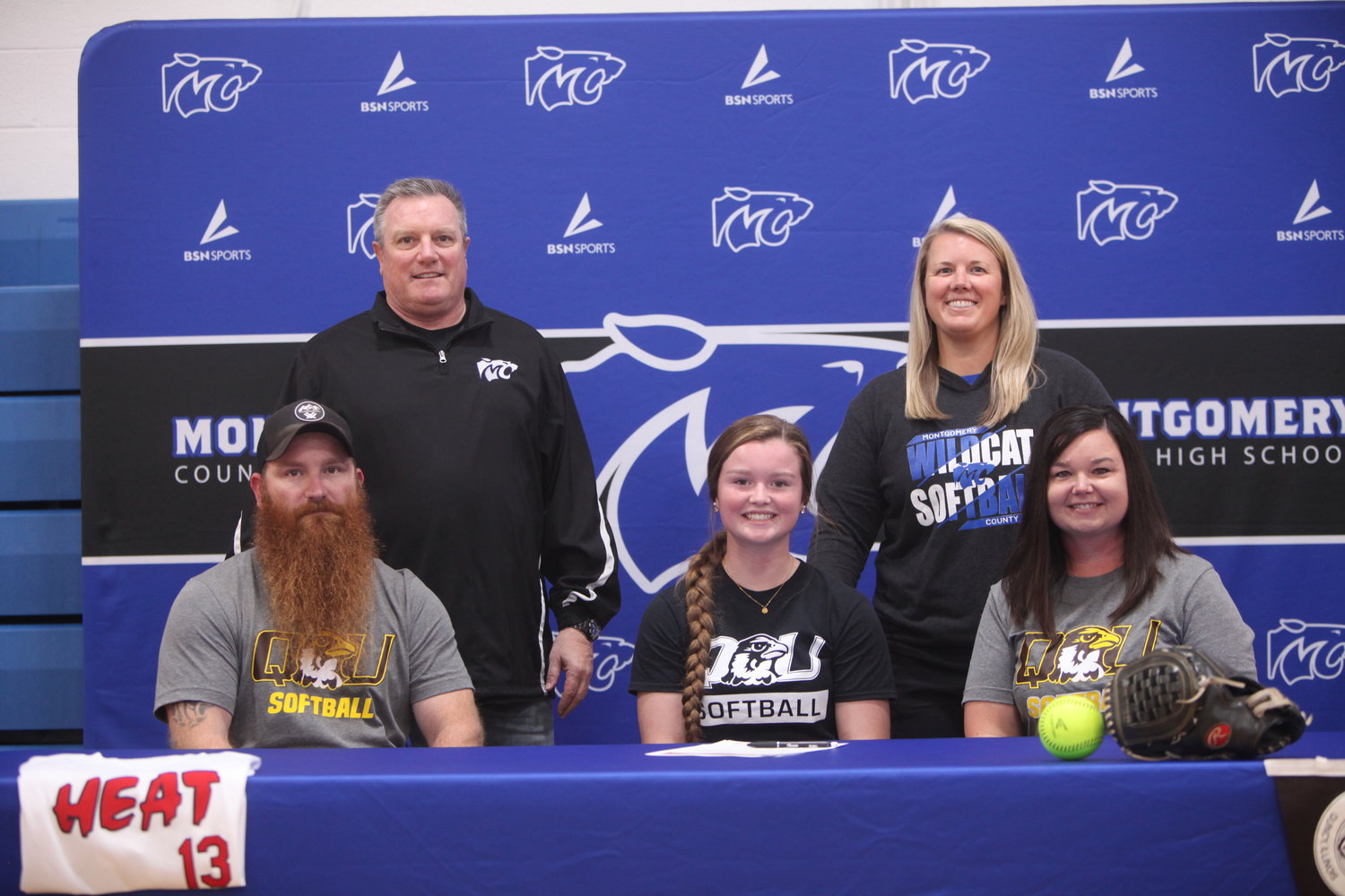 Montgomery County senior Brooklynn Fischer signed a letter of intent to play softball for Quincy University on Nov. 12. Pictured, front row from left, are father Rick Fischer, Brooklynn Fischer and mother Lacy Fischer. Back row are MCHS assistant coach Don Moultrie and head coach Audra Heimer.