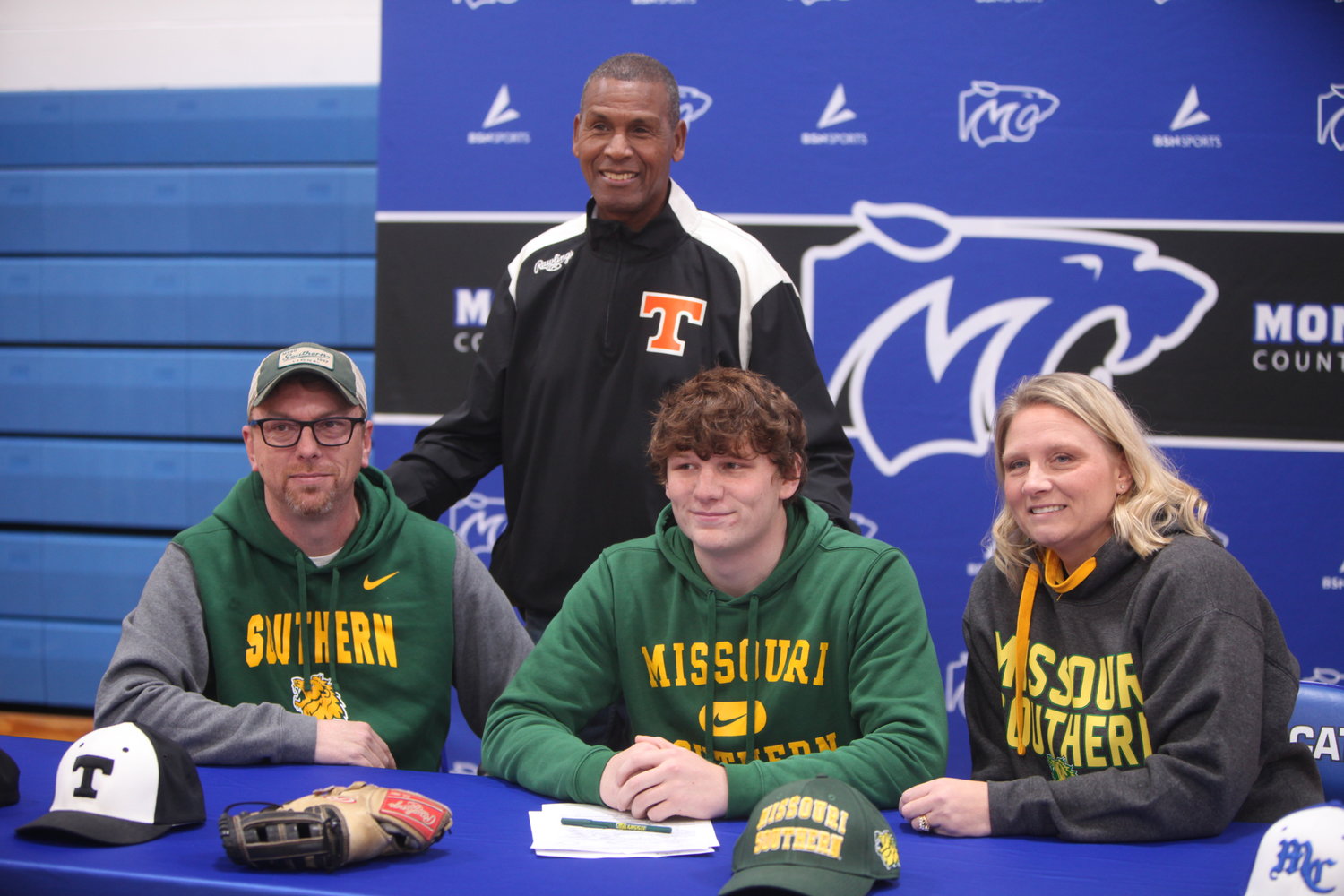 Montgomery County senior Evan Abercrombie signed a letter of intent to play baseball for Missouri Southern State University. Pictured, front row from left, are father Brad Abercrombie, Evan Abercrombie and Mandy Abercrombie. Back row is Rawlings Tigers baseball coach Grayling Tobias.