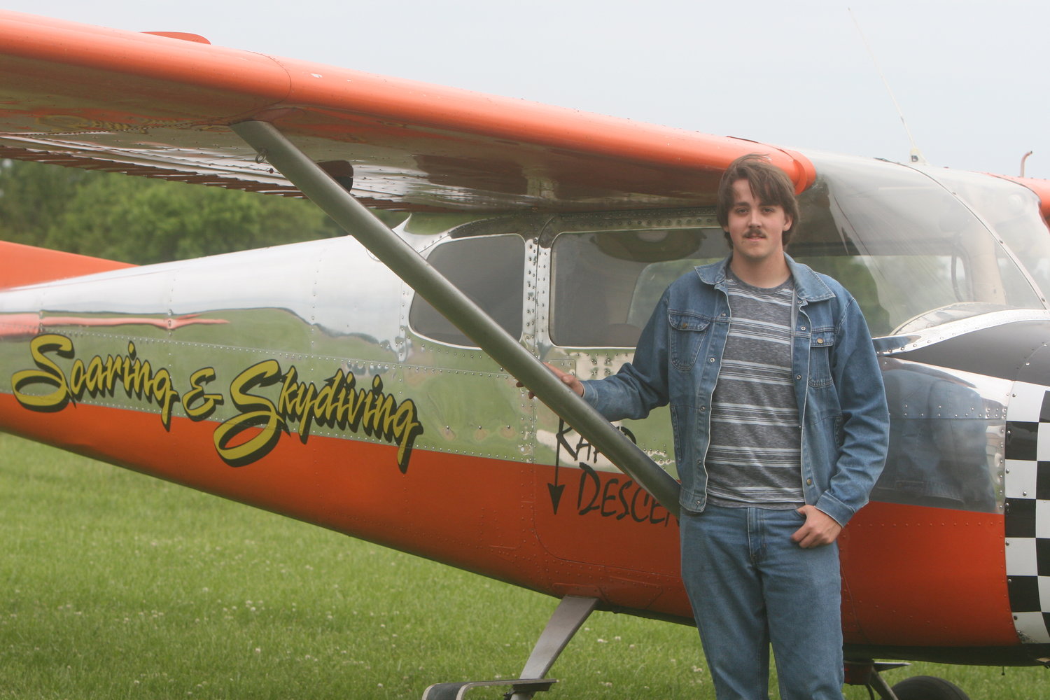 Montgomery County resident Jonas Uthe poses with his 1956 airplane at the back of U-Store-It in Montgomery City on May 23. The 17-year-old Uthe recently received his private pilot’s license.