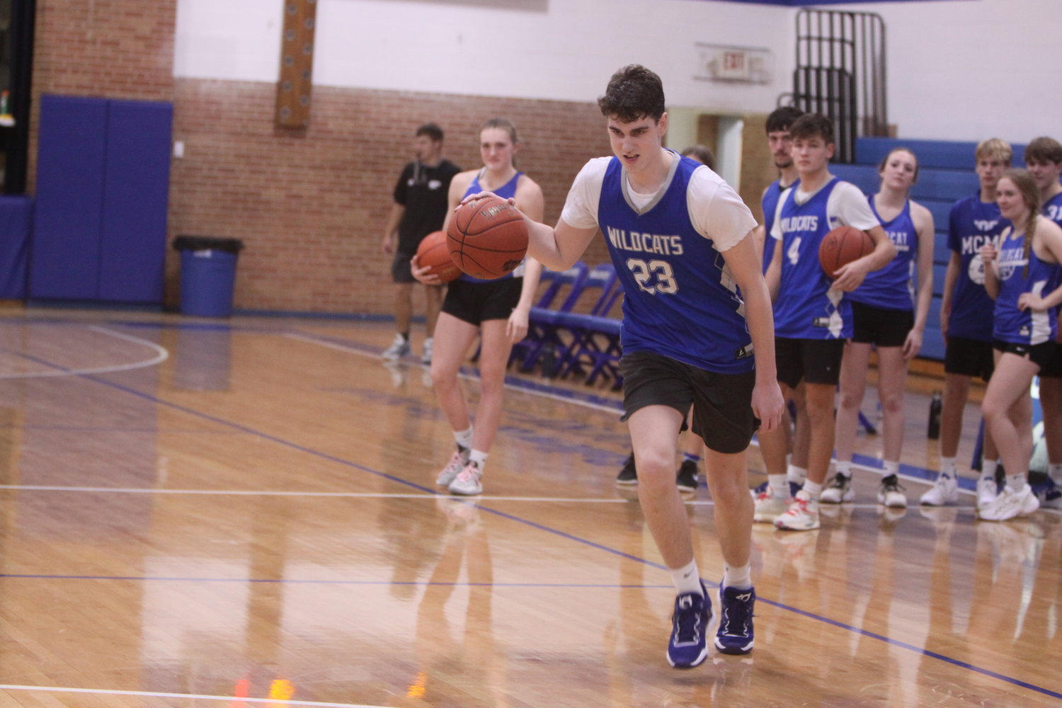Montgomery County sophomore Clayton Parker dribbles up the court during the Blue and White scrimmage on Nov. 10 at Ballew & Snell Court. Parker is the Wildcats’ top returner from last year’s team that won 17 games and captured a district title.
