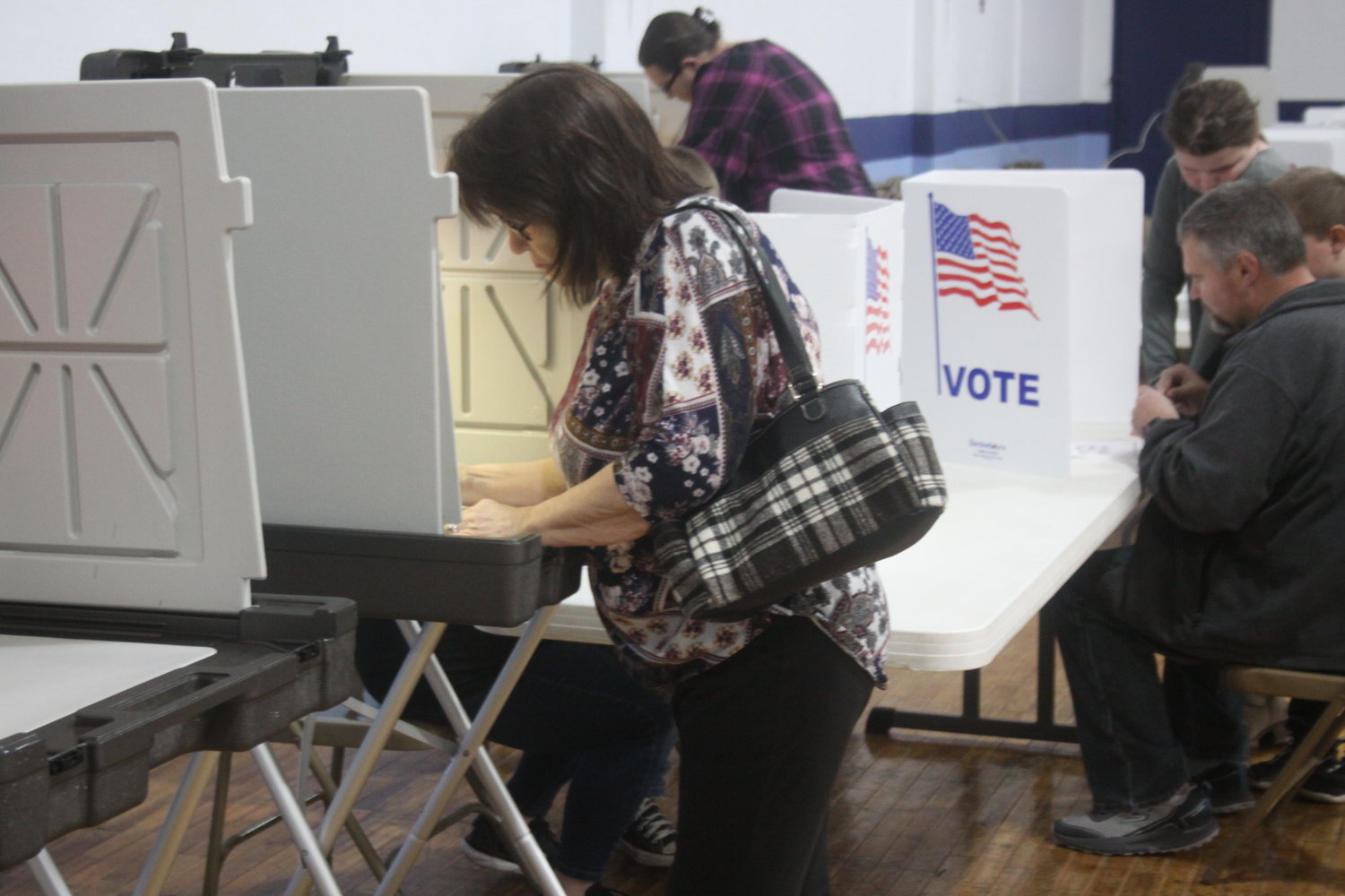 A Montgomery City resident votes during the early morning hours on Nov. 8 at the Knights of Columbus building.