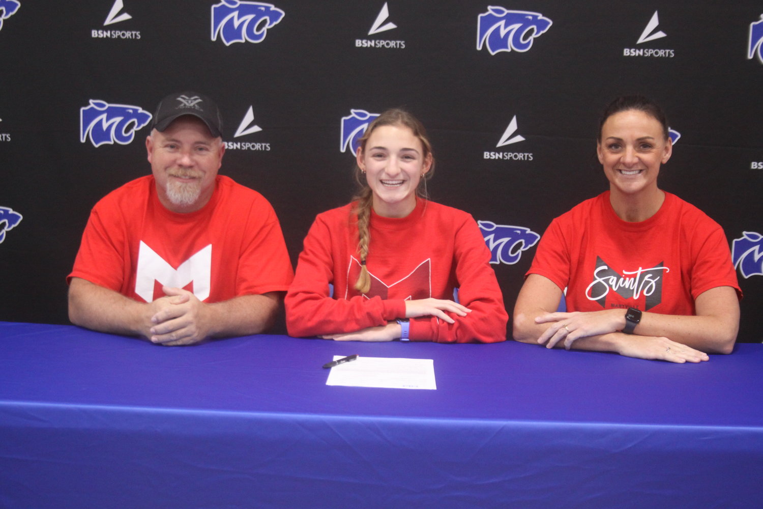Montgomery County senior Lyric Ford signs a letter of intent to run cross country and track at Maryville University for the 2023-24 school year. Pictured are, father Clint Ford, Lyric Ford and mother Miranda Ford.