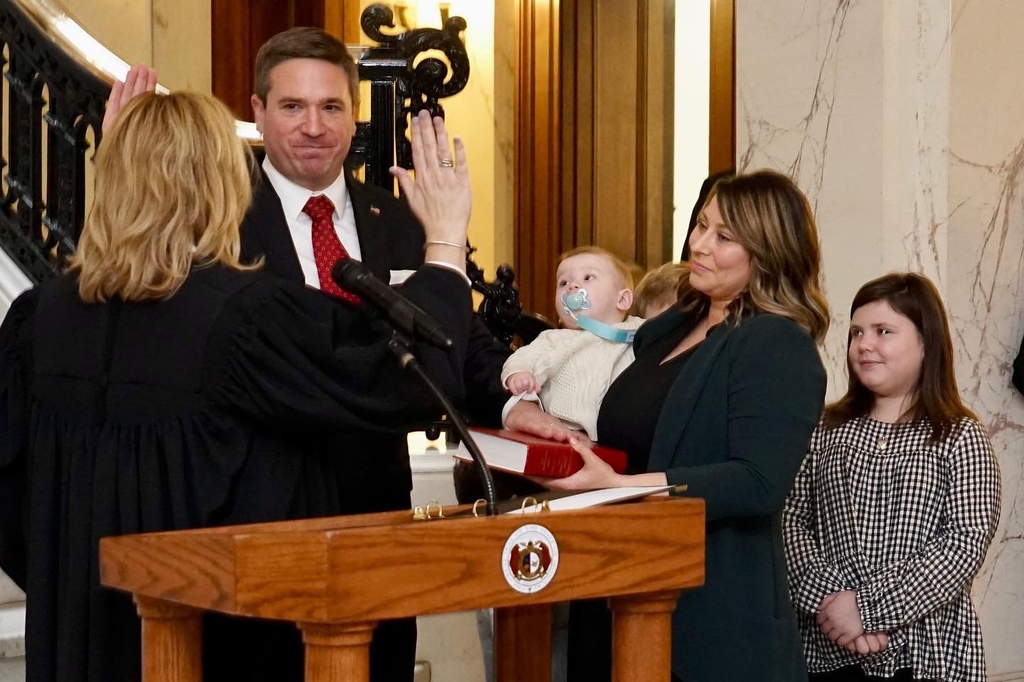 Rhineland resident Andrew Bailey is sworn in as Missouri Attorney General on Jan. 3 in Jefferson City, while his wife and children look on.