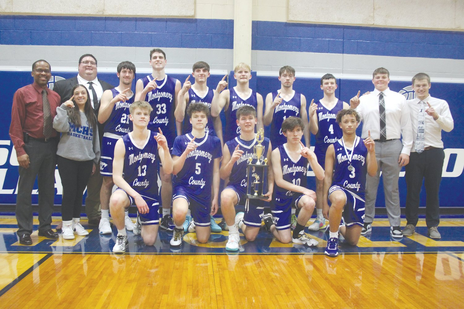 The Montgomery County boys basketball team poses with its South Callaway Tournament championship trophy after beating Hermann 67-65 in the title game on Jan. 14. The Wildcats won their fifth South Callaway title.