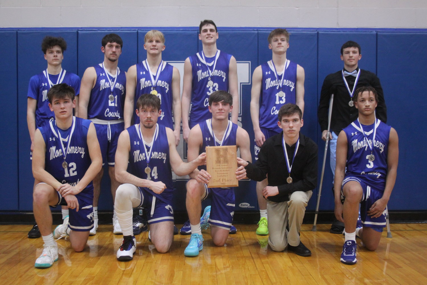 The Montgomery County boys basketball team poses with its second-place plaque after losing to Hermann 45-38 in the championship game of the Hermann Invitational Tournament on Jan. 28.