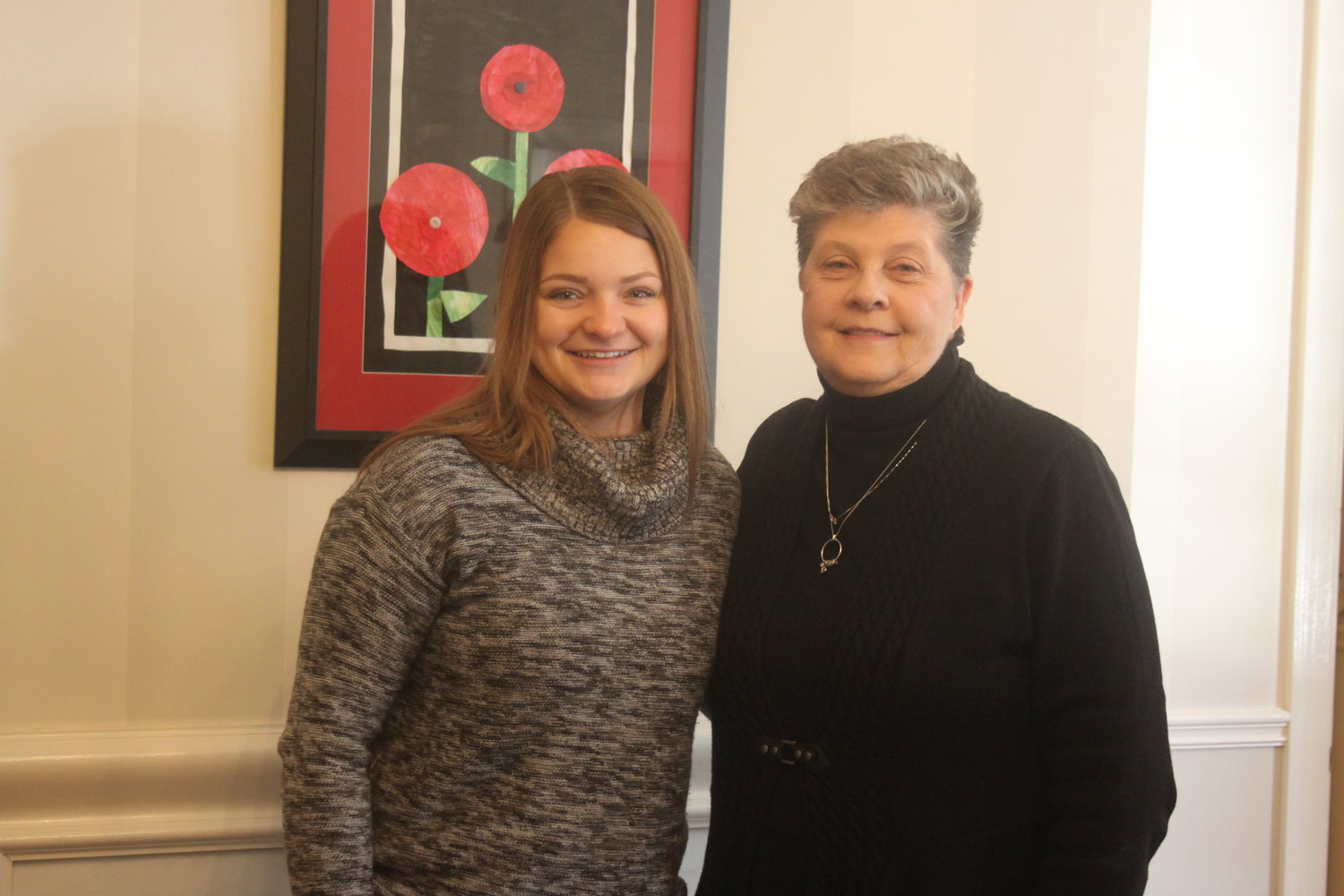 Schlanker Funeral Home director Carol Mills, right, poses with Irelynn Kobusch at the funeral home on Jan. 27. Mills plans to retire as director in February, while Kobusch will take over duties.