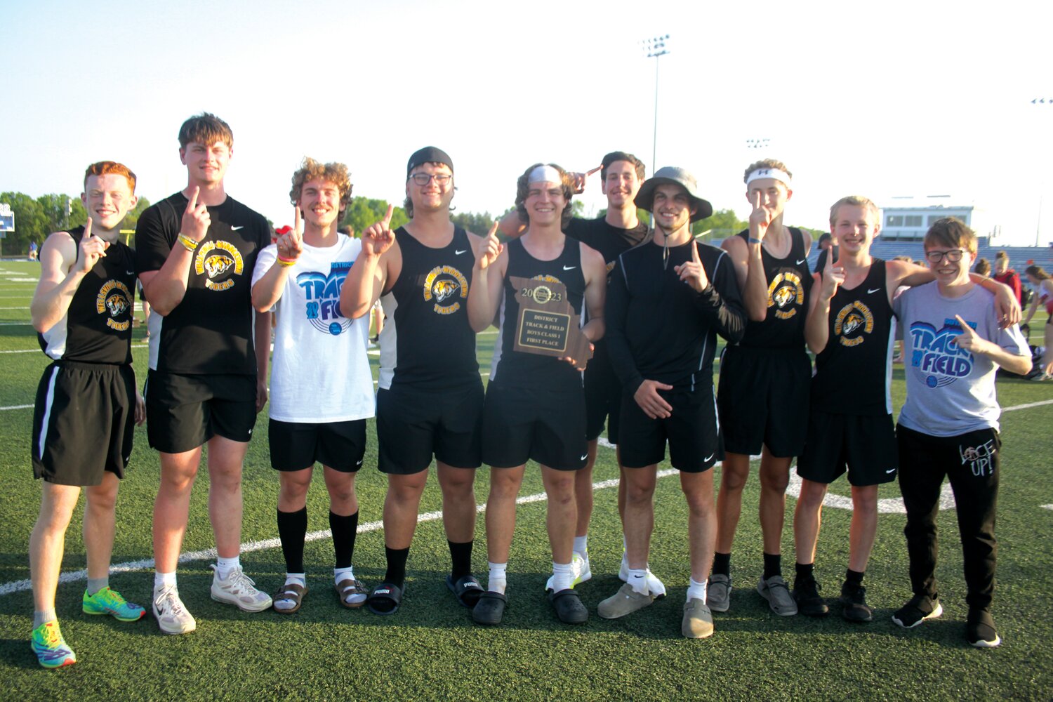 The Wellsville-Middletown boys track team poses with its district championship trophy after winning the Class 1, District 2 championship meet on May 6 at South Callaway High School. Pictured, from left, are Hunter Bickell, Logan Pursifull, Lucas Moore, Kadyn Emily, Dylan Alsop, Cooper Henderson, Jacob Mandrell, Gage Marshall, Jonah Slovensky and Zackery Vogel.