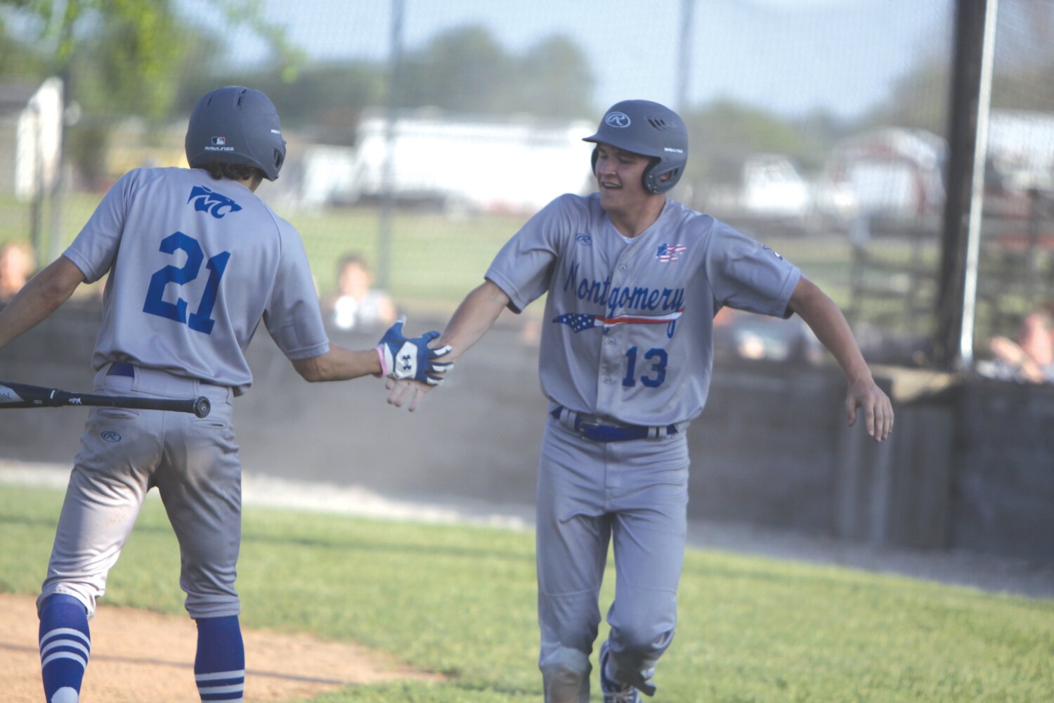 Montgomery County junior centerfielder Mason Leu, right, is congratulated by junior Dayton Simmons after scoring a run in the top of the seventh against North Callaway. Leu and the Wildcats won 7-0 to clinch a share of the conference title with Elsberry at 9-1.