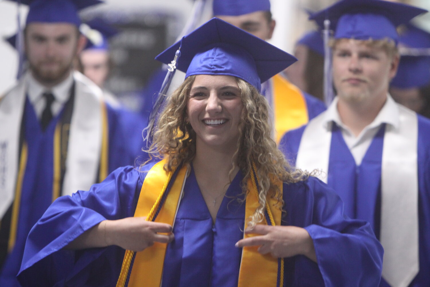 Marina Ridenhour walks down the school hallway to go to the graduation ceremony at Montgomery County High School on May 19, which was also her 18th birthday.